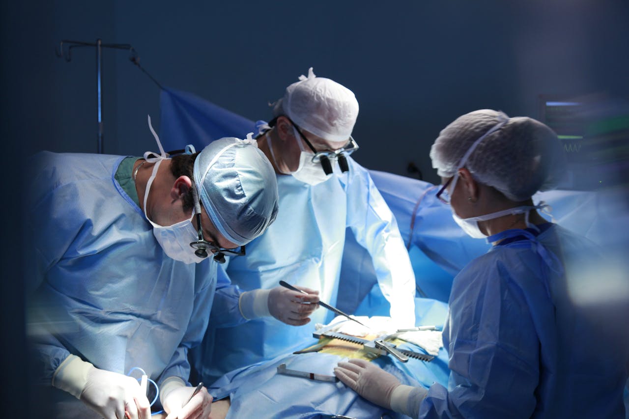 our-story Team of surgeons meticulously performing surgery in a sterile operating room, highlighting expert medical care.