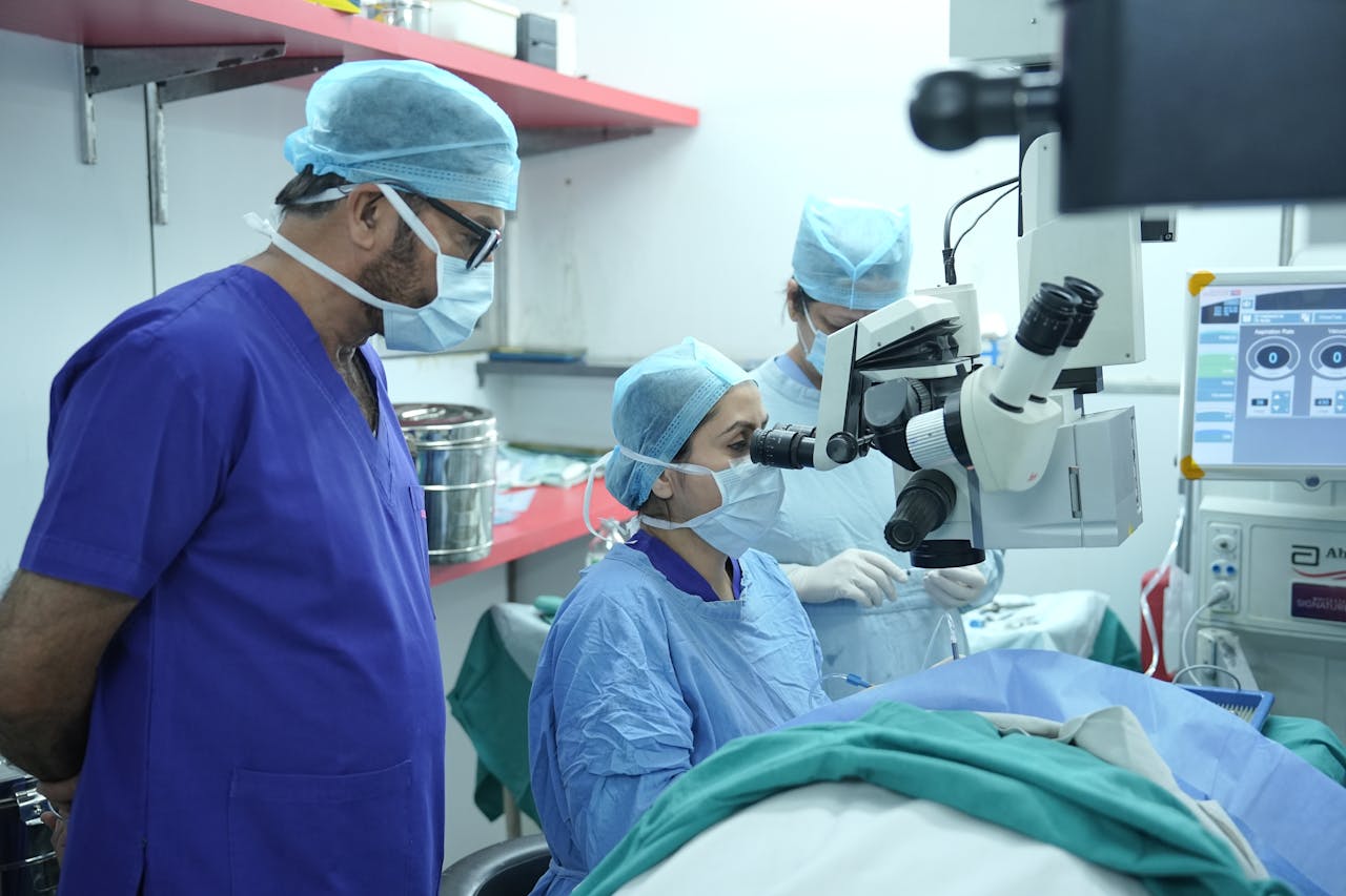 who-we-are Surgeons performing eye surgery in a New Delhi hospital operating room.